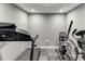 Home gym featuring a treadmill and elliptical for at-home workouts and fitness at 3898 Heritage Oaks Dr, Powder Springs, GA 30127