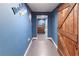 Basement hallway features Baseball themed decor and sliding barn door at 3898 Heritage Oaks Dr, Powder Springs, GA 30127