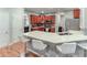 Kitchen features a white quartz breakfast bar with seating and cherry wood cabinets at 3898 Heritage Oaks Dr, Powder Springs, GA 30127