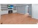 Spacious living room with hardwood floors, built-in shelves, a fireplace, and a television at 3898 Heritage Oaks Dr, Powder Springs, GA 30127