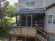Screened porch features an outdoor deck and stairs leading to the backyard at 3898 Heritage Oaks Dr, Powder Springs, GA 30127