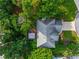 Aerial view of a home showcasing its deck, roof, landscaping, and surrounding greenery at 540 Shale Ct, Alpharetta, GA 30022