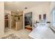 Luxurious bathroom featuring a standalone tub, glass enclosed shower, and an open view of the bedroom at 540 Shale Ct, Alpharetta, GA 30022