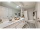 Bathroom with double sink vanity, geometric floor tiles, and shower-tub combination at 540 Shale Ct, Alpharetta, GA 30022