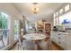 Open-concept kitchen and dining area with an outdoor view and modern lighting at 540 Shale Ct, Alpharetta, GA 30022