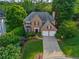 Beautiful brick two-story home with a two-car garage and a well-manicured lawn at 540 Shale Ct, Alpharetta, GA 30022