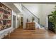Elegant foyer with hardwood floors, staircase, and stylish decor at 540 Shale Ct, Alpharetta, GA 30022