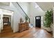 Bright foyer with a staircase, hardwood floors, and elegant decor at 540 Shale Ct, Alpharetta, GA 30022