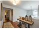 Upstairs hallway with hardwood floors, rustic table decor, and ample lighting at 540 Shale Ct, Alpharetta, GA 30022