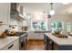 Bright kitchen with stainless steel appliances, white cabinets, and a subway tile backsplash at 540 Shale Ct, Alpharetta, GA 30022