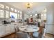 Bright kitchen with white cabinets, subway tile backsplash, stainless steel appliances, and a round breakfast table at 540 Shale Ct, Alpharetta, GA 30022