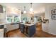 Modern kitchen featuring an island with a built-in wine cooler, connecting to the dining and living rooms at 540 Shale Ct, Alpharetta, GA 30022