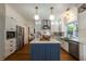 Stylish kitchen with stainless steel appliances, white cabinets, and a center island at 540 Shale Ct, Alpharetta, GA 30022