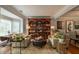 Cozy living room featuring a built-in bookshelf, comfortable seating, and natural light at 540 Shale Ct, Alpharetta, GA 30022