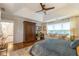 Airy main bedroom with hardwood floors, a sitting area, and many windows for natural light at 540 Shale Ct, Alpharetta, GA 30022
