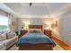 Comfortable main bedroom with a ceiling fan, hardwood floors, and ample natural light at 540 Shale Ct, Alpharetta, GA 30022