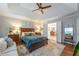Bright main bedroom featuring hardwood floors, ensuite bath, and refined decor at 540 Shale Ct, Alpharetta, GA 30022