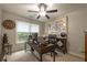 Bright office space with a ceiling fan, large window, and modern desk setup at 540 Shale Ct, Alpharetta, GA 30022