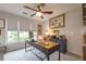 Bright office space with a ceiling fan, large window, and classic decor at 540 Shale Ct, Alpharetta, GA 30022