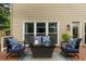 Cozy outdoor patio with comfortable seating and a view of the backyard at 540 Shale Ct, Alpharetta, GA 30022