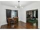 Bright dining room with hardwood floors, natural lighting, and views into the living room at 1192 Arlington Sw Ave, Atlanta, GA 30310