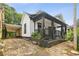 A charming home featuring a covered carport, a covered porch, and landscaping at 1192 Arlington Sw Ave, Atlanta, GA 30310