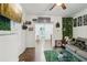 Cozy living room flowing into the kitchen, complete with a fireplace and hardwood floors at 1192 Arlington Sw Ave, Atlanta, GA 30310