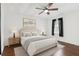 A relaxing bedroom with ceiling fan, neutral colors, and wood flooring at 1192 Arlington Sw Ave, Atlanta, GA 30310