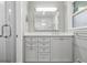 Updated bathroom with a gray vanity, modern fixtures, and glass-enclosed shower at 2516 Cherry Hill Ln, Atlanta, GA 30360
