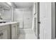 Bathroom featuring double sinks, marble countertop, a large mirror, and shower with sliding glass doors at 2516 Cherry Hill Ln, Atlanta, GA 30360