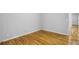 Spacious bedroom with gleaming hardwood floors, light gray walls and natural light at 2516 Cherry Hill Ln, Atlanta, GA 30360