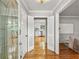 Bright foyer featuring hardwood floors and decorative glass front door leads to the open kitchen at 2516 Cherry Hill Ln, Atlanta, GA 30360