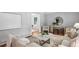 Cozy living room with neutral tones, hardwood floors, and comfortable seating arrangement, great for entertaining at 2516 Cherry Hill Ln, Atlanta, GA 30360
