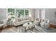 Inviting living room with a stylish rug, comfortable seating, and abundant natural light, perfect for relaxation at 2516 Cherry Hill Ln, Atlanta, GA 30360