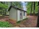 Well-maintained outbuilding featuring wood siding and a small window at 2516 Cherry Hill Ln, Atlanta, GA 30360