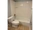 Bathroom with a tile-enclosed tub and shower combination and standard toilet at 2855 Peachtree Ne Rd # 106, Atlanta, GA 30305