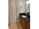 Bathroom featuring a vanity with dark countertops, toilet, and modern fixtures at 2855 Peachtree Ne Rd # 106, Atlanta, GA 30305