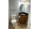 Bathroom featuring a vanity with a dark countertop, toilet, and modern fixtures at 2855 Peachtree Ne Rd # 106, Atlanta, GA 30305
