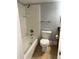 Traditional bathroom with a tub and shower combination, ceramic tile and a toilet at 2855 Peachtree Ne Rd # 106, Atlanta, GA 30305