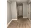 Neutral hallway with multiple doors and carpeted flooring offers access to various rooms at 2855 Peachtree Ne Rd # 106, Atlanta, GA 30305