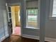 Inviting living room with hardwood floors, natural light, and an open doorway to a covered porch at 2855 Peachtree Ne Rd # 106, Atlanta, GA 30305