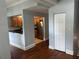 Open-concept living space featuring hardwood floors and a glimpse into the kitchen, blending living and dining at 2855 Peachtree Ne Rd # 106, Atlanta, GA 30305