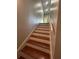Staircase with wooden steps and painted risers leading to the upper level, showing great detailing at 2855 Peachtree Ne Rd # 106, Atlanta, GA 30305