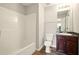 Bathroom featuring a tub, toilet, single vanity, and wood-look flooring at 3731 Laramie Rd, Ellenwood, GA 30294
