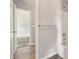 Bright bathroom featuring wood-look floors, a tub and shower, and access to a bedroom at 3731 Laramie Rd, Ellenwood, GA 30294