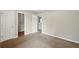 Bedroom featuring neutral carpet, light walls, and closets, plus trim molding at 3731 Laramie Rd, Ellenwood, GA 30294