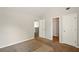 Bedroom featuring neutral carpet, light walls, and two closets, plus trim molding at 3731 Laramie Rd, Ellenwood, GA 30294