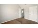 Simple bedroom with neutral paint and carpet at 3731 Laramie Rd, Ellenwood, GA 30294