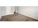 This bedroom has neutral walls, carpet, and white doors at 3731 Laramie Rd, Ellenwood, GA 30294