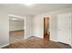 Dining room featuring wood-look flooring, neutral paint, and entry to the bathroom at 3731 Laramie Rd, Ellenwood, GA 30294